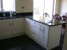 cream painted kitchen with star galaxy granit