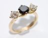18ct gold white and black diamond three stone ring.