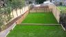 Landscaped garden with retaining walls and grass